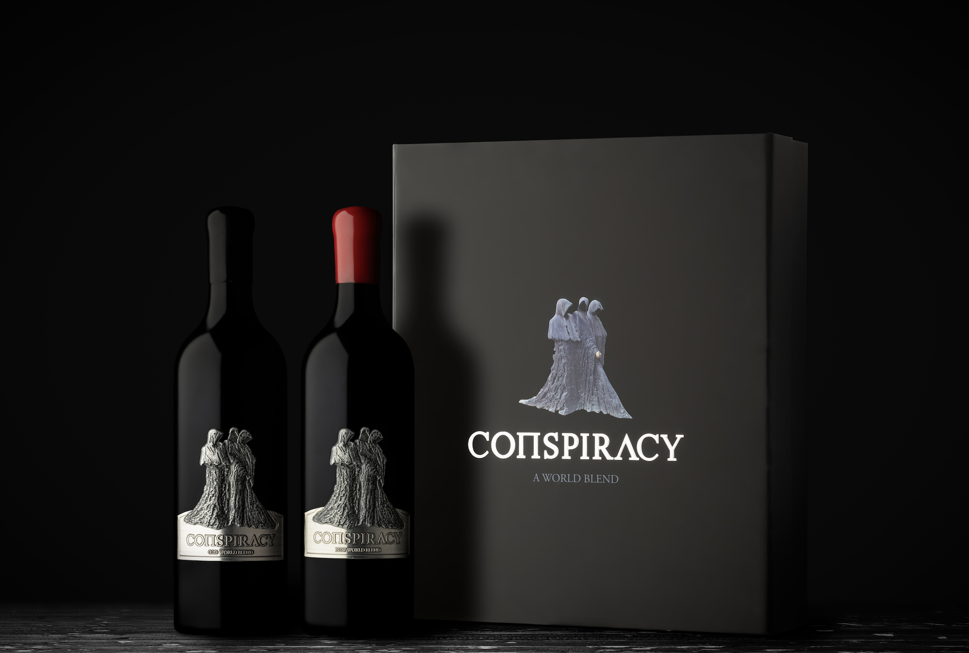 Conspiracy wine bottles — Old World and New World blends — beside a presentation box with the Conspiracy logo