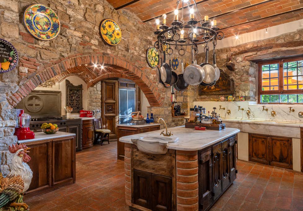 Traditional farmhouse kitchen with stone and brick vaults
