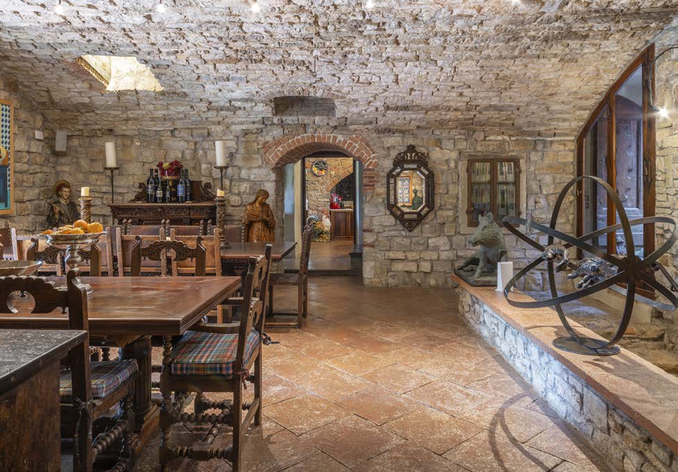 Multi-level interior with stone walls and medieval decor